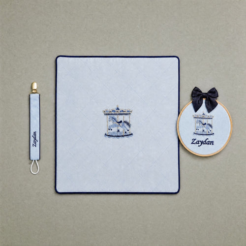 Just the Essentials ice blue gift bundle laid out flat — personalised ice blue silk wrapping sheet, name frame and pacifier holder