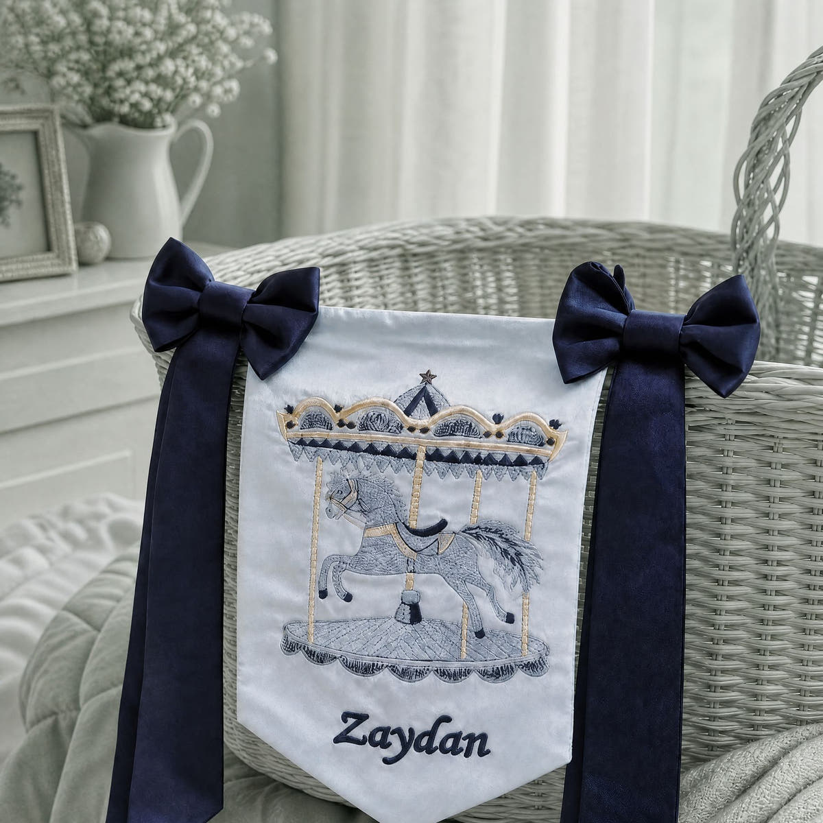 Personalised ice blue silk name flag hanging on a nursery wall