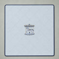 Ice blue silk baby wrapping sheet with navy trim, an embroidered carousel and a name in navy script