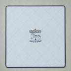 Ice blue silk baby wrapping sheet with navy trim, an embroidered carousel and a name in navy script