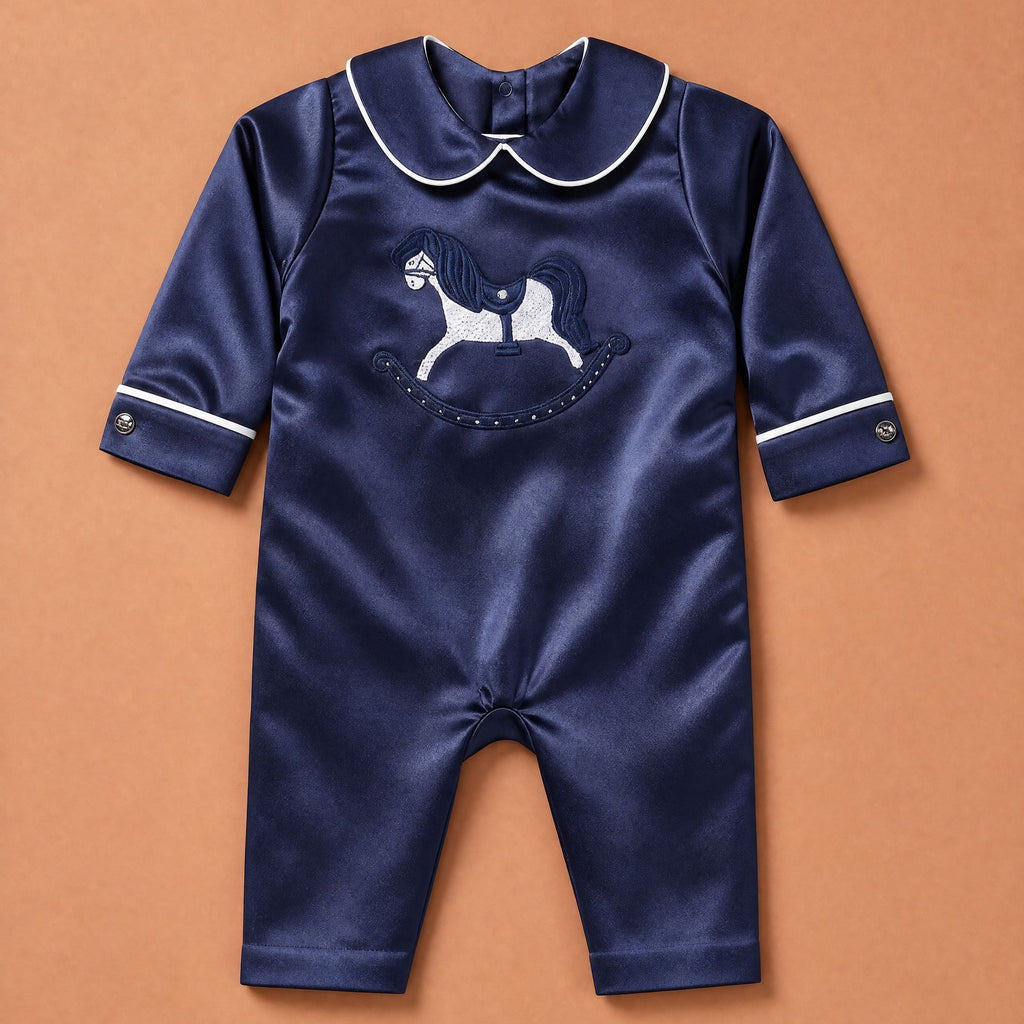 Navy silk baby romper with ivory piping, Peter Pan collar and an embroidered ivory rocking horse on the chest