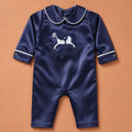 Navy silk baby romper with ivory piping, Peter Pan collar and an embroidered ivory rocking horse on the chest