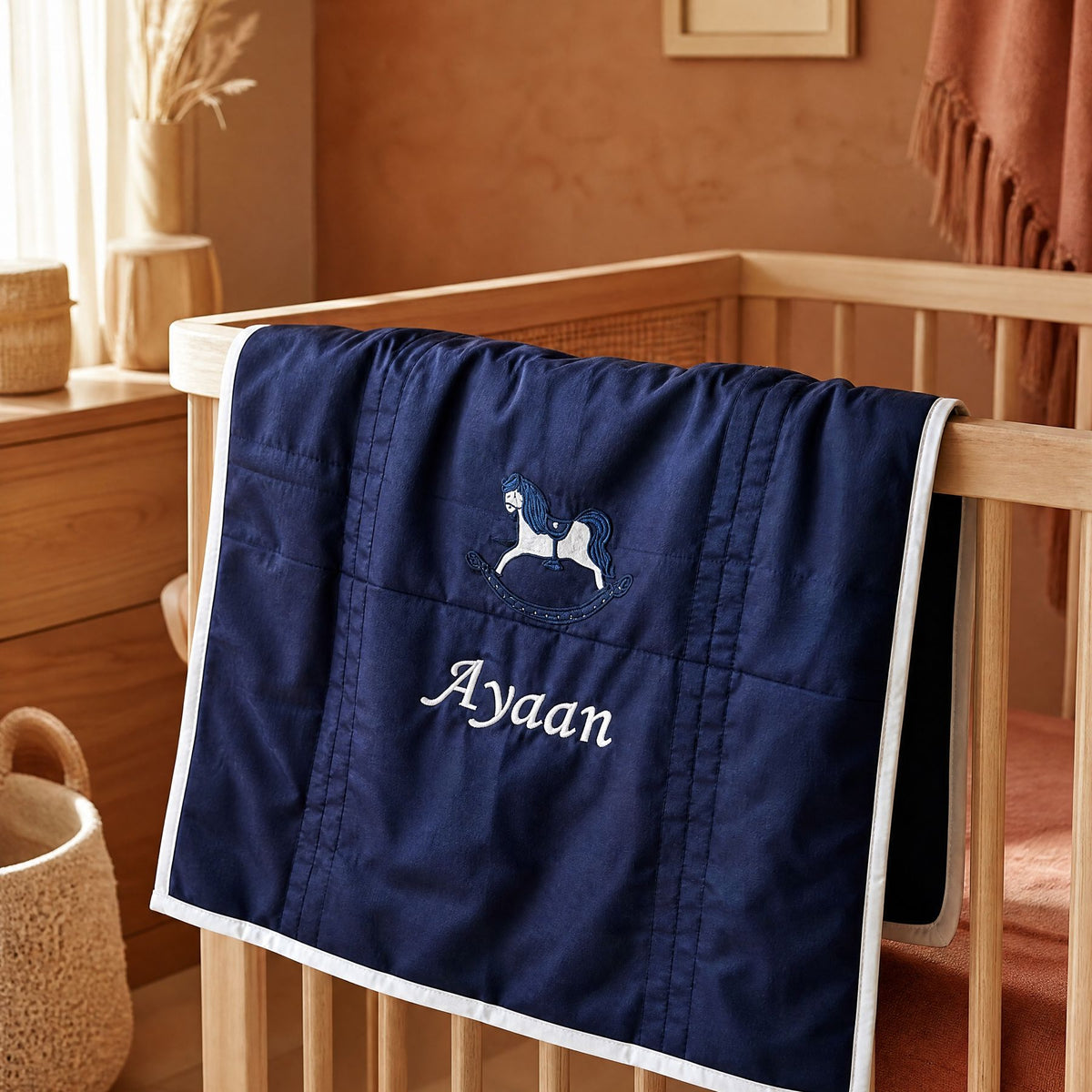 Navy silk baby wrapping sheet styled in a nursery setting