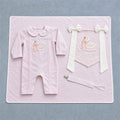 Welcome to the World pink gift bundle laid out flat — personalised pink silk romper, wrapping sheet, name flag and pacifier holder