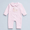 Soft pink silk baby romper with a Peter Pan collar, tonal piping and an embroidered white swan with a pink ribbon bow at the chest