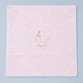 Quilted pink silk baby wrapping sheet with white binding, an embroidered swan and a name in soft pink script