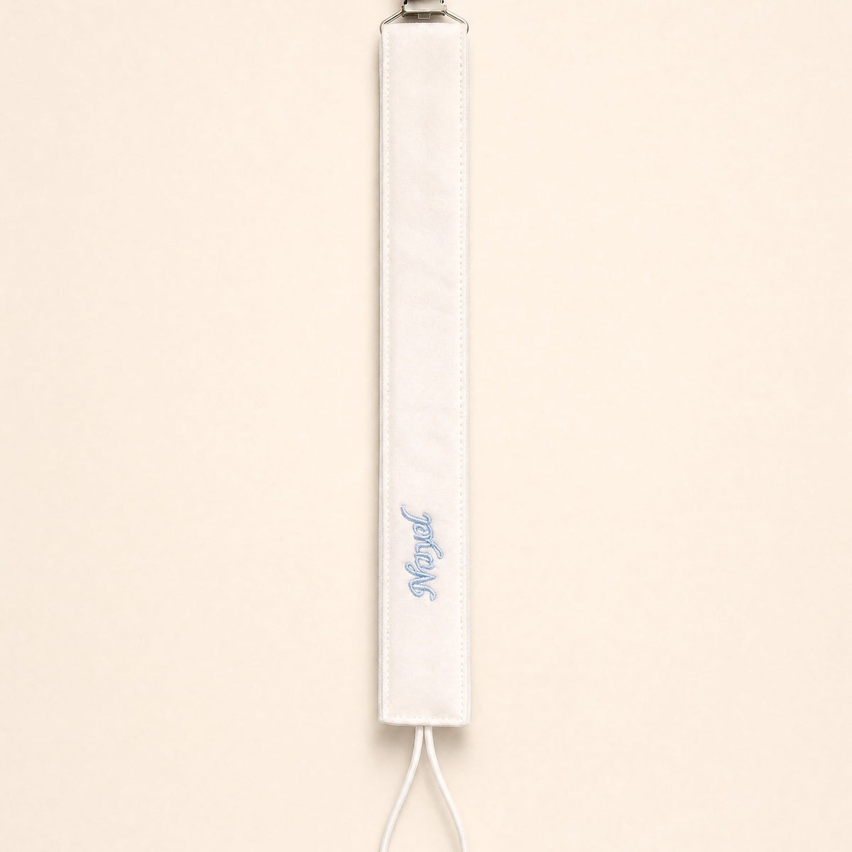 Ivory silk pacifier holder with pale blue detailing and a baby's name embroidered in pale blue script