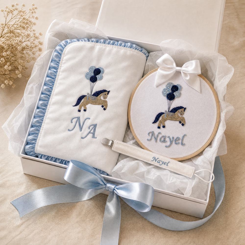 Just the Essentials gift set — personalised silk wrapping sheet, name frame and pacifier holder in a ribboned gift box